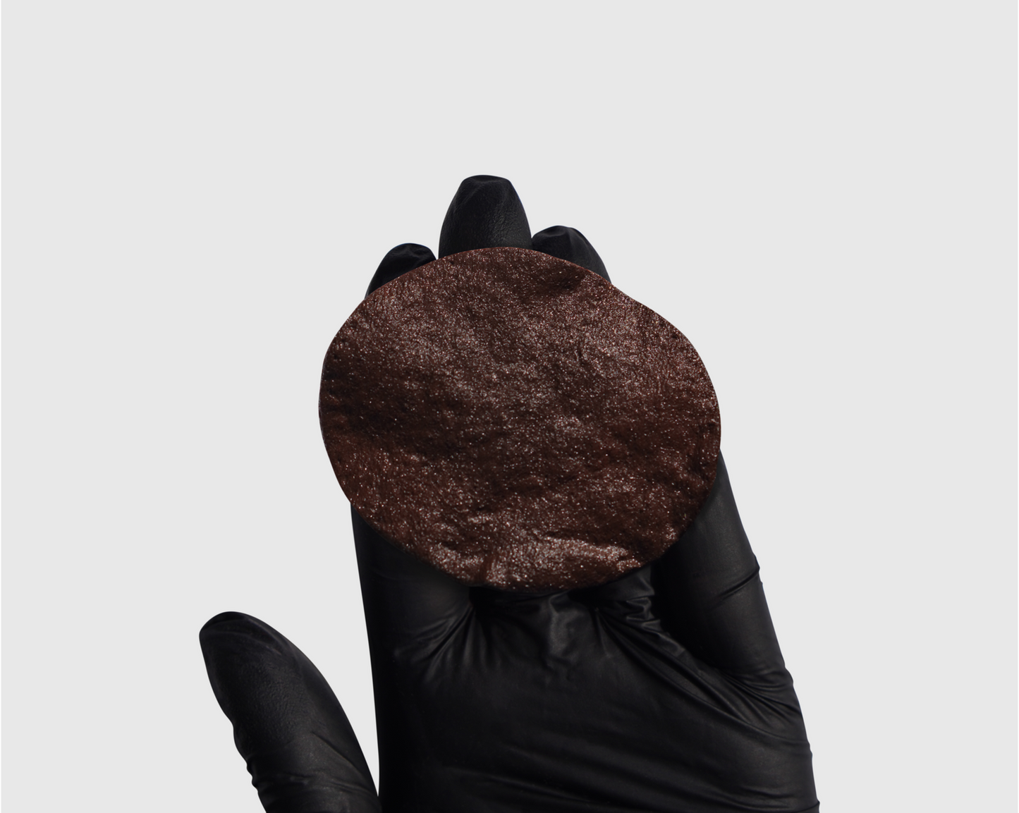 Dark Coffee swatch on cotton pad – warm brown