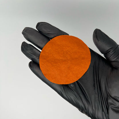 Orange Neutralizer swatch on cotton pad – medium orange